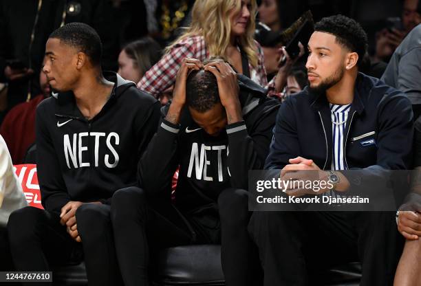 Kevin Durant and Ben Simmons of the Brooklyn Nets sit on the bench during the closing minutes of the game against Los Angeles Lakers during the game...