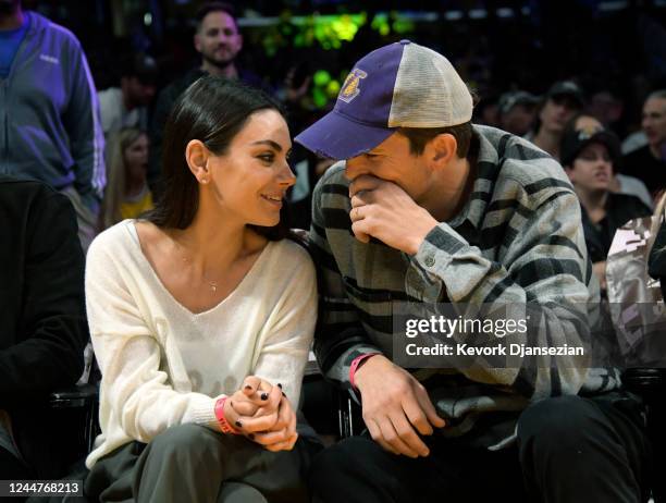 Mila Kunis and Ashton Kutcher attend a basketball between the Los Angeles Lakers and the Brooklyn Nets at Crypto.com Arena on November 13, 2022 in...