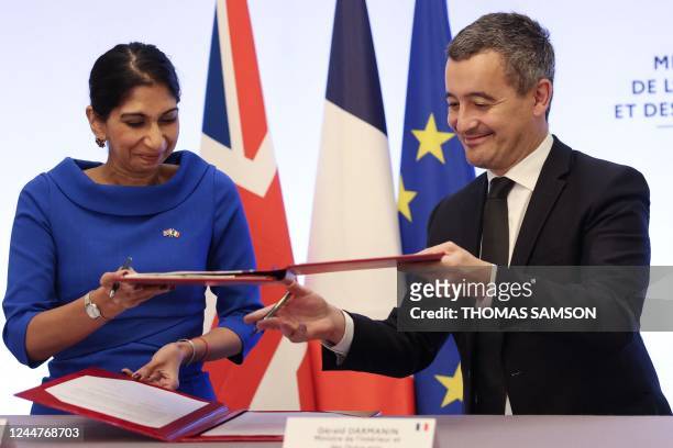 French Interior Minister Gerald Darmanin and Britain's Home Secretary Suella Braverman sign a joint declaration signature at the Hotel Beauvau...
