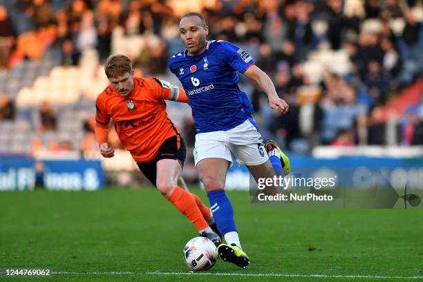 Lois Maynard of Oldham Athletic tussles with Dale Gorman of Barnet Football Club during the Vanarama National League match between Oldham Athletic...