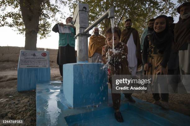 Child washes his hands with water from the water-well in Kabul, Afghanistan on October 31, 2022 as it is voluntarily established by an NGO, the...