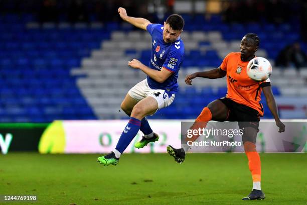 Nathan Sheron of Oldham Athletic tussles with Idris Kanu of Barnet Football Club during the Vanarama National League match between Oldham Athletic...