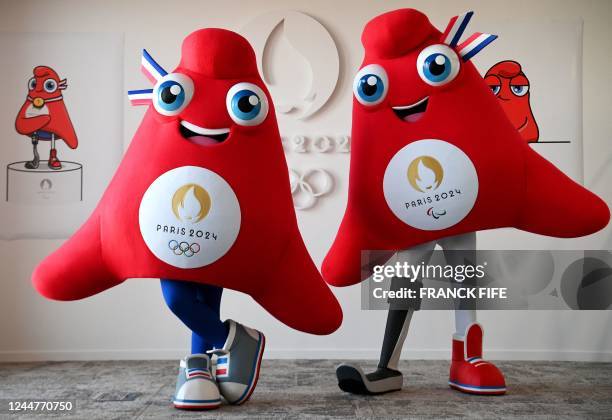 This photograph taken on November 10 shows the mascots for the Paris 2024 Olympic and Paralympic Games 'Les Phryges' in Saint-Denis, north of Paris....