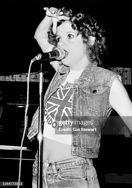 Annie Golden, wearing a Carnaby Street t-shirt, of US punk band The Shirts performs on stage at Dingwalls, London, England, in July, 1978.