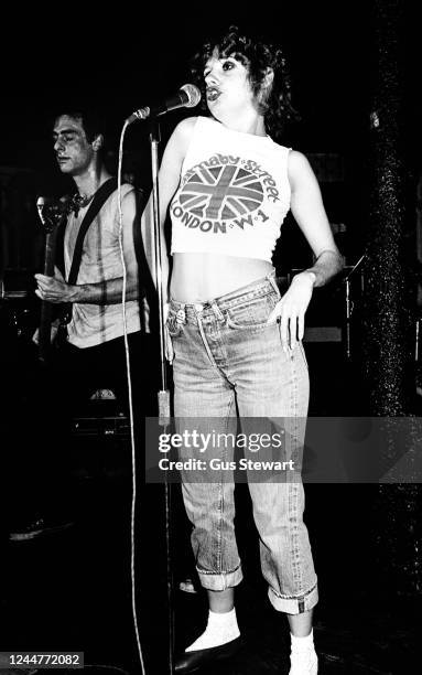 Annie Golden, wearing a Carnaby Street t-shirt, of US punk band The Shirts performs on stage at Dingwalls, London, England, in July, 1978.