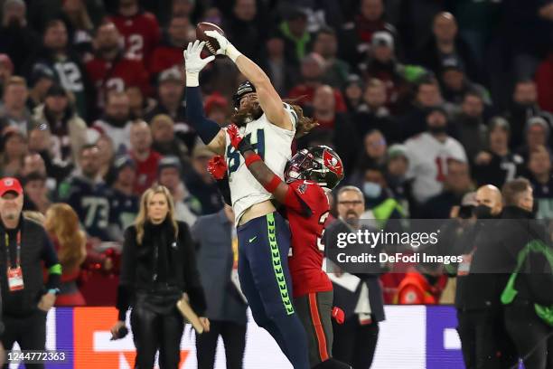 Colby Parkinson of Seattle Seahawks and Mike Edwards of Tampa Bay Buccaneers battle for the ball during the NFL match between Seattle Seahawks and...