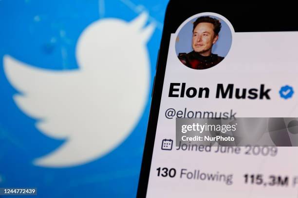 Elon Musk account on Twitter displayed on a phone screen and Twitter logo displayed on a laptop screen are seen in this illustration photo taken in...