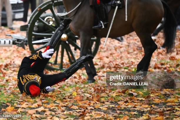 Soldier reacts after falling off a horse as members of the King's Troop, Royal Horse Artillery, arrive at Green Park for a gun salute celebrating the...