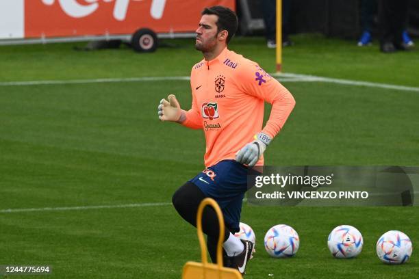 Brazil's goalkeeper Alisson attends a training session on November 14, 2022 at the Continassa training ground in Turin, northern Italy, as part of...