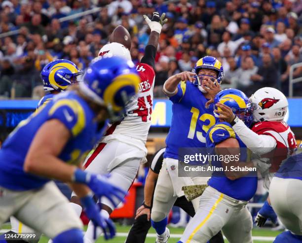 Los Angeles, CA Cardinals outside linebacker Myjai Sanders deflects a pass by Rams backup quarterback John Wolford, #13, during the second half at...