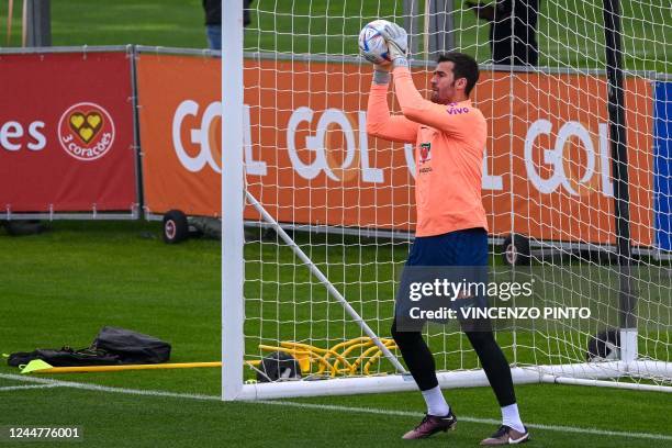 Brazil's goalkeeper Alisson attends a training session on November 14, 2022 at the Continassa training ground in Turin, northern Italy, as part of...