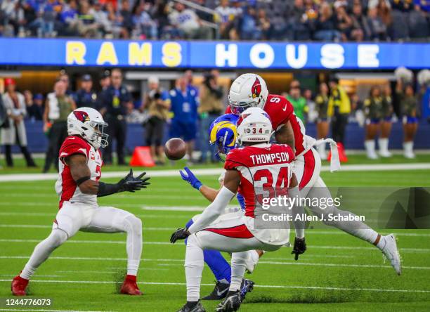 Los Angeles, CA Los Angeles, CA Rams wide receiver Ben Skowronek, #18, bobbles a pass under pressure from linebacker Isaiah Simmons, #9, and safety...