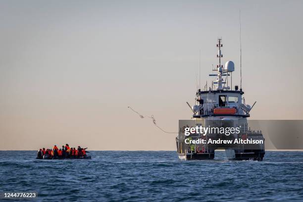 Small boat packed with people is rescued in English waters by BF Defender operated by Border Force and overseen by HMS Severn in the middle of the...