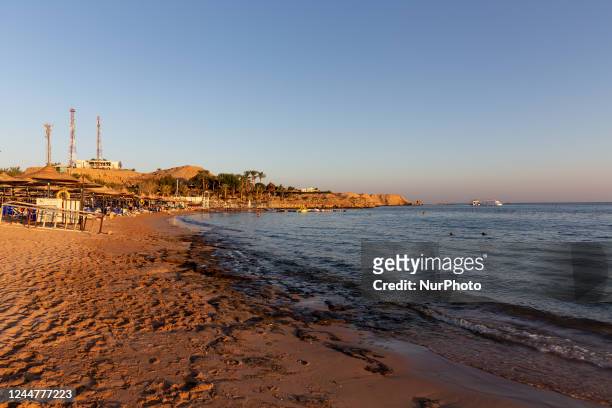Sunset on the beach of the resort town of Sharm El Sheikh on Red Sea coast in South Sinai, Egypt on November 14, 2022. Sharm El Sheikh is well known...