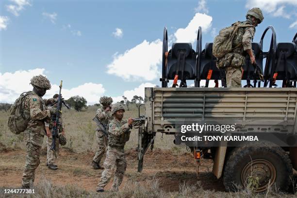 Soldiers that are part of a training battle group comprising 1 Rifles, 1 Yorks and 1 Irish Guards battalions mount their transport vehicles during a...