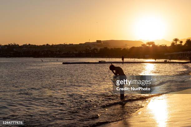 Sunset on the beach of the resort town of Sharm El Sheikh on Red Sea coast in South Sinai, Egypt on November 14, 2022. Sharm El Sheikh is well known...