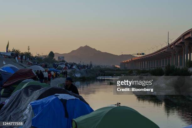 Makeshift migrant encampment near the Rio Grande in Ciudad Juarez, Mexico, on Sunday, Nov. 13, 2022. Poverty in Venezuela fell for the first time in...
