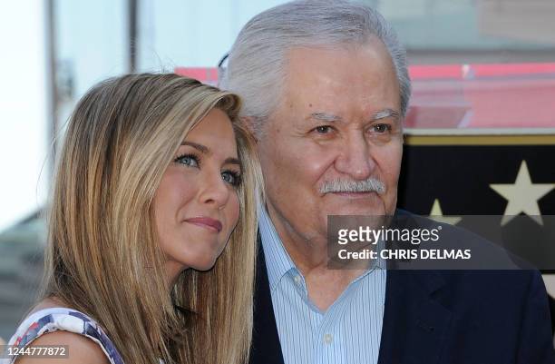 Actress Jennifer Aniston stands for a photo with her father, Greek-US actor John Aniston, during her Hollywood Walk of Fame star ceremony in...