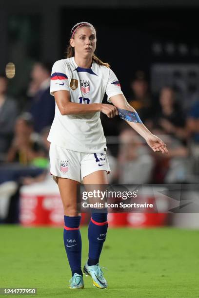 Alex Morgan takes the captain roll as she puts on the captains arm band during the game between Germany and the U.S.A. On Thursday, November 10, 2022...