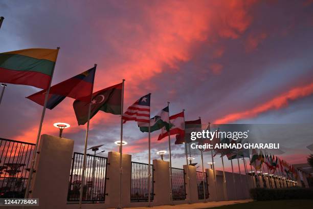 The flags of United Nations member states Lithuania, Liechtenstein, Libya, Liberia, Lesotho, Lebanon, Latvia, Laos, Kyrgyzstan, Kuwait, Kiribati,...