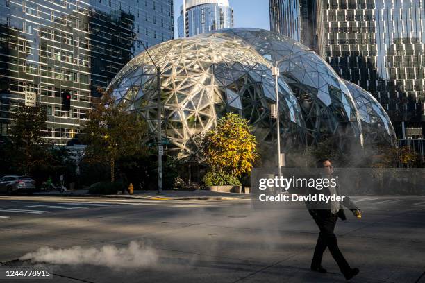 Person walks by The Spheres at the Amazon.com Inc. Headquarters on November 14, 2022 in Seattle, Washington. Large scale layoffs are expected at the...