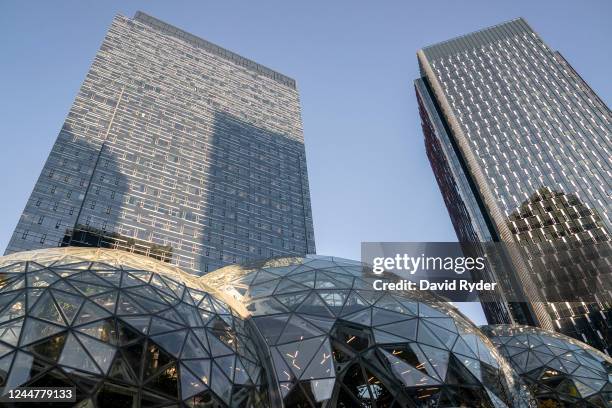 Corporate office buildings rise above The Spheres at the Amazon.com Inc. Headquarters on November 14, 2022 in Seattle, Washington. Large scale...