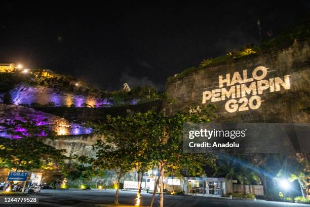 Greenpeace Indonesia projecting a message to a hill, before G20 Summit at Melasti beach in Bali, on 14 November 2022. The message is addressed to G20...