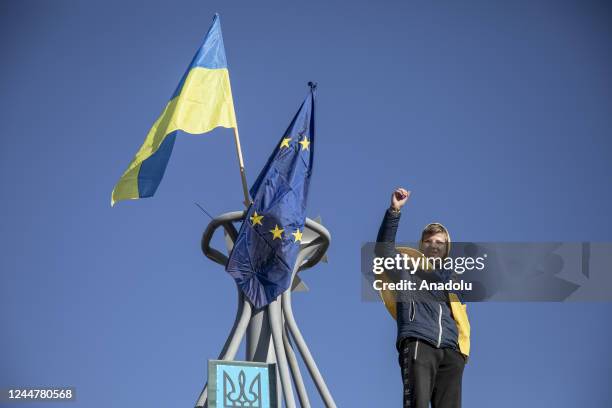 Civilians carrying Ukrainian flags celebrate at Independence Square after the withdrawal of the Russian army from Kherson to the eastern bank of...