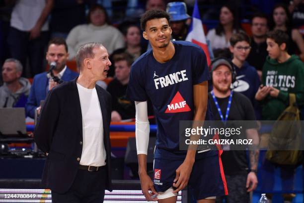 France's manager Vincent Collet and Victor Wembanyama talk before the FIBA Basketball World Cup 2023 Qualifiers match between France and...