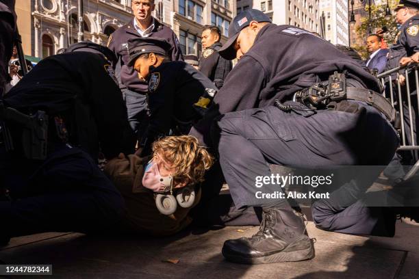 Police arrest Counter-protestors for transgender rights on November 14, 2022 in New York City. Around fifty pro-transgender rights activists confront...