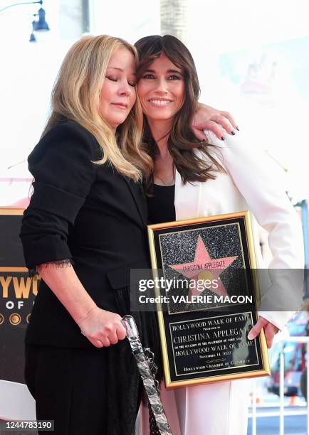 Actress Christina Applegate and US actress Linda Cardellini pose for photos with Applegate's newly unveiled Hollywood Walk of Fame star in Hollywood,...