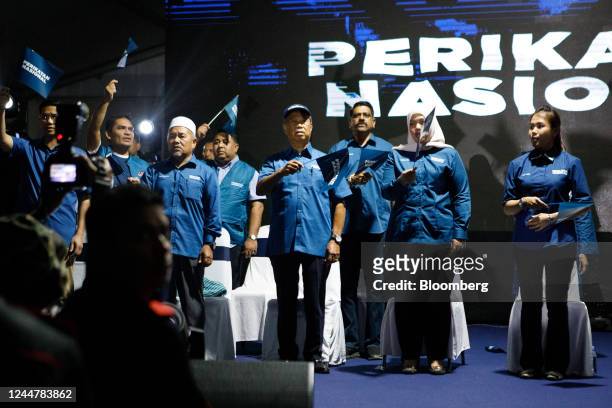 Muhyiddin Yassin, Malaysia's former prime minister and the leader of Perikatan Nasional party, fourth right, at a campaign rally in Kuala Lumpur,...