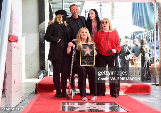 Actress Christina Applegate, joined by daughter Sadie Grace LeNoble, husband Martyn LeNoble, and US actress Nancy Priddy, poses for photos with...