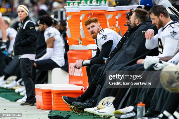 New Orleans Saints quarterback Andy Dalton looks on from the bench during the national football league game between the New Orleans Saints and the...