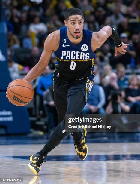 Tyrese Haliburton of the Indiana Pacers brings the ball up court against the Toronto Raptors at Gainbridge Fieldhouse on November 12, 2022 in...