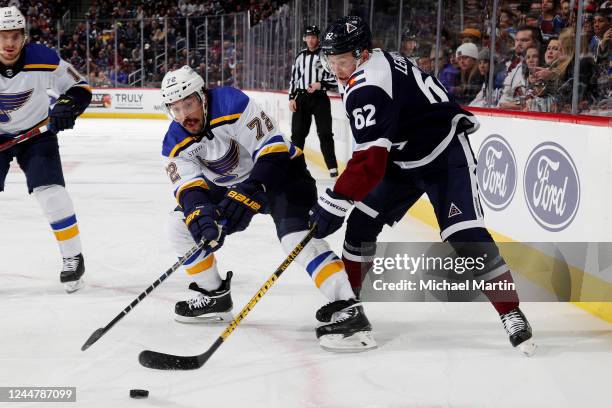 Justin Faulk of the St. Louis Blues skates against Artturi Lehkonen of the Colorado Avalanche at Ball Arena on November 14, 2022 in Denver, Colorado.