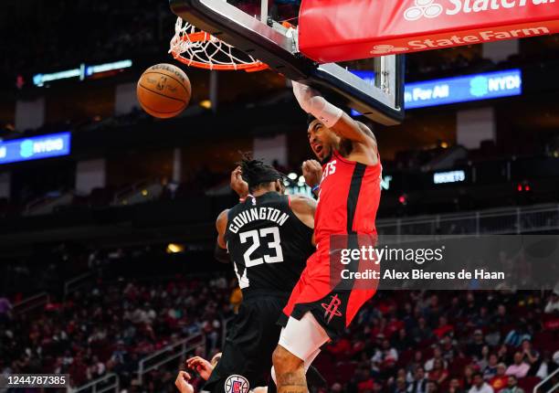 Kenyon Martin Jr. #6 of the Houston Rockets dunks over Robert Covington of the LA Clippers during the fourth quarter of the game at the Toyota Center...