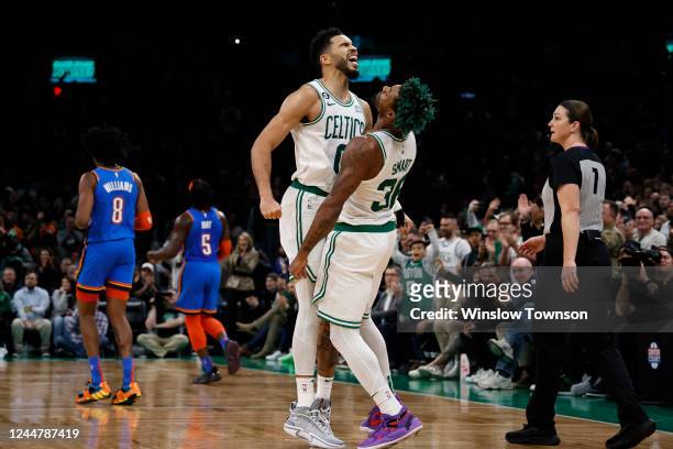 Jayson Tatum of the Boston Celtics celebrates with Marcus Smart after a basket late in the fourth quarter as Jalen Williams of the Oklahoma City...