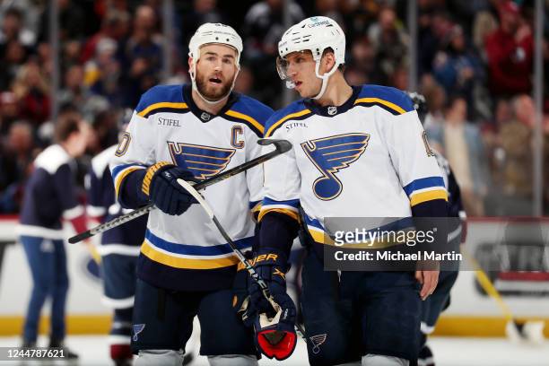 Ryan O'Reilly and Brayden Schenn of the St. Louis Blues converse during a pause in play against the Colorado Avalanche at Ball Arena on November 14,...
