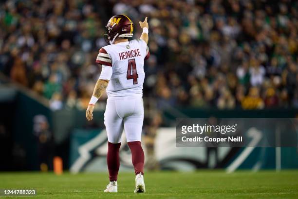 Taylor Heinicke of the Washington Commanders celebrates after a play against the Philadelphia Eagles during the second half at Lincoln Financial...