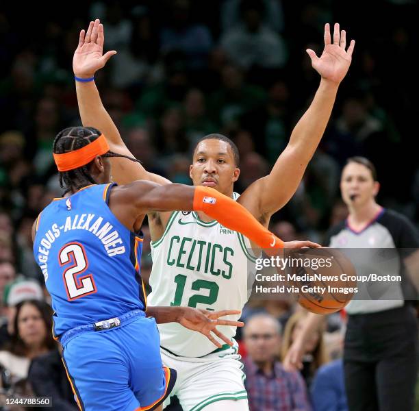 November 14: Grant Williams of the Boston Celtics defends Shai Gilgeous-Alexander of the Oklahoma City Thunder during the first half of the NBA game...