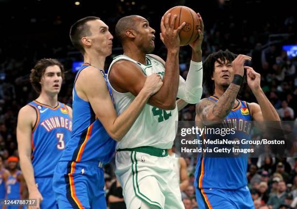 November 14: Aleksej Pokusevski of the Oklahoma City Thunder fouls Al Horford of the Boston Celtics as Josh Giddey and Jaylin Williams look on during...