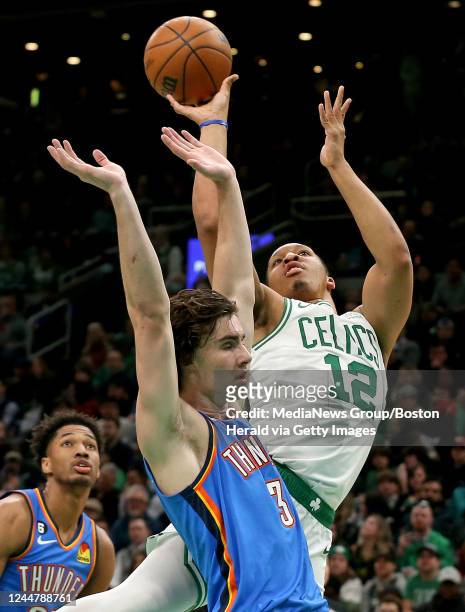 November 14: Grant Williams of the Boston Celtics shoots above Josh Giddey of the Oklahoma City Thunder during the first half of the NBA game at the...