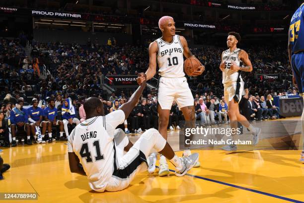 Jeremy Sochan helps up Gorgui Dieng of the San Antonio Spurs during the game against the Golden State Warriors on November 14, 2022 at Chase Center...