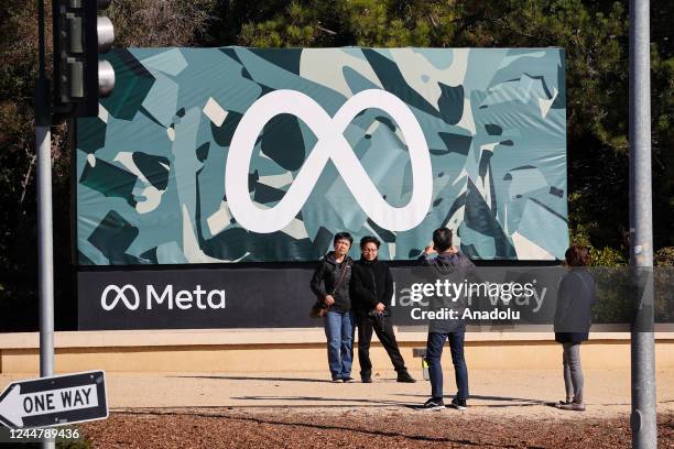 Visitors take photos in front of Meta sign in Menlo Park, California, United States on November 14, 2022.