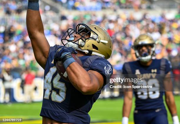 Navy Midshipmen fullback Daba Fofana celerbrates after running for a touchdown during the Notre Dame game versus the Naval Academy Midshipmen on...