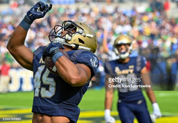Navy Midshipmen fullback Daba Fofana celerbrates after running for a touchdown during the Notre Dame game versus the Naval Academy Midshipmen on...