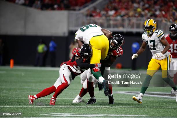 Green Bay Packers tight end Martellus Bennett is tackled by Atlanta Falcons strong safety Keanu Neal and Atlanta Falcons cornerback Brian Poole...