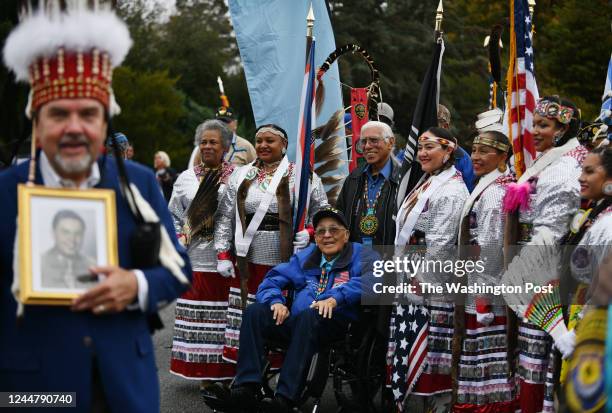 Army retiree Donald E. Loudner, National Commander of the National American Indian Veterans, of the Hunkpati Dakota Sioux tribe, center in the...