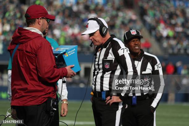 Referee Terry McAulay looks at the replay on the Microsoft Tablet viewing station during an NFL football game between the Houston Texans against the...